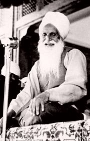 Hazur Baba Sawan Singh holding Satsang